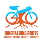 Bikepacking Roots logo, bike in blue and orange to represent sky and land